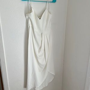 White dress used for engagement photos. Fits comfortable. Good condition